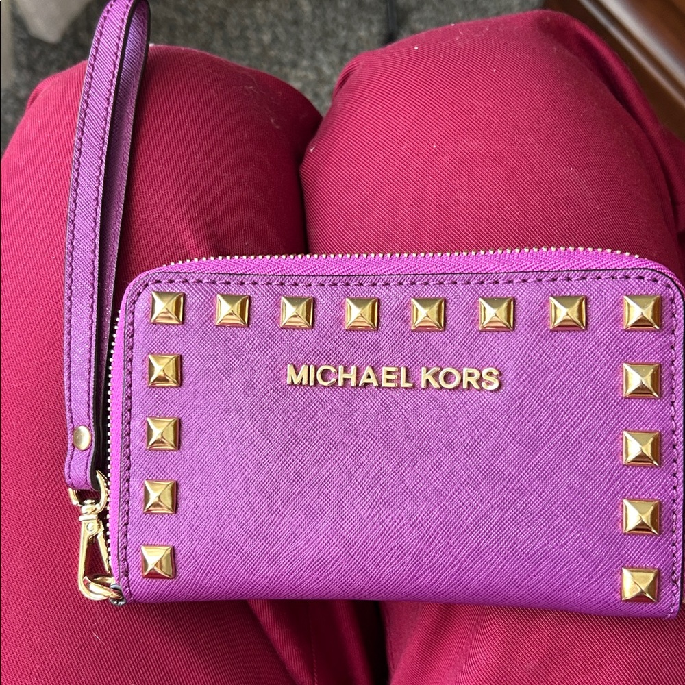 Gorgeous Michael Kors Purple Wristlet with gold studs accents